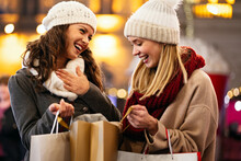 Happy Women Friends Are Shopping For Presents At Christmas. People Holiday Sale Shopping Concept