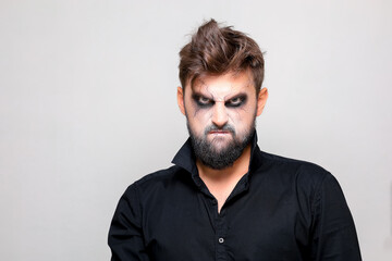 Wall Mural - bearded men with makeup for Halloween looks at the camera