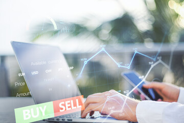 Poster - Close up of hands using laptop and cellphone with forex chart and sell, buy buttons on blurry background. Stock exchange, cryptocurrency and global fund information concept. Double exposure.