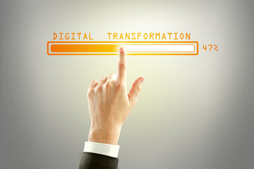 Poster - Businessman hand pointing at abstract glowing loading bar on gray wall background. Digital transformation, internet, progress and technology concept.