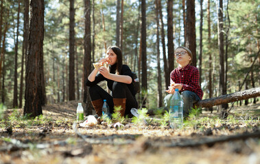 Wall Mural - son and mother eating in the woods