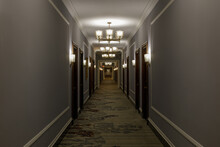 Empty Luxurious Hotel Corridor Lit By Chandeliers In San Francisco, CA
