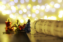 Christmas Decorations On Music Sheets, Closeup