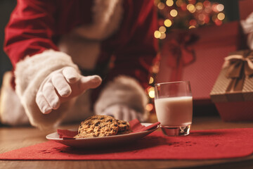 Santa Claus having a delicious snack