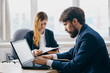 © SHOTPRIME STUDIO - business man and woman in the office in front of a laptop career network officials