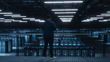 Poster - Data Center Engineer Using Laptop Computer. Server Farm Cloud Computing Specialist Facility with African American Male System Administrator Working with Data Protection Network for Cyber Security.