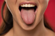 young woman showing tongue