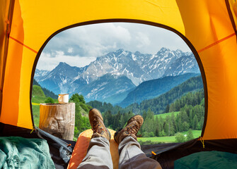 spectacular view of nature from open tent entrance. the beauty of romantic trekking and camping.