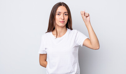 Poster - hispanic pretty woman feeling serious, strong and rebellious, raising fist up, protesting or fighting for revolution