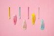 Colorful pastel accessories hairpin on pink background, close up, trendy modern from past