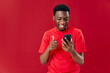 © SHOTPRIME STUDIO - Cheerful man of african appearance with mobile phone laughing