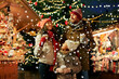 © Syda Productions - family, winter holidays and celebration concept - happy mother, father and little daughter with takeaway drinks at christmas market on town hall square in tallinn, estonia over snow