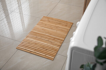 Poster - Wooden mat on floor near washing machine in bathroom