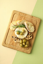 Concept Of Tasty Food With Grilled Camembert On Two Tone Background