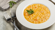 Close-up Of Risotto With Pumpkin And Taleggio Cheese, Decorated With Sage Leaves. Banner Size.