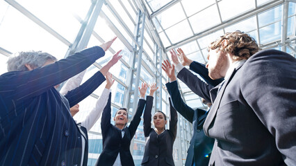 Successful business people with high-five