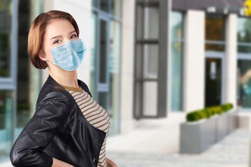 Wall Mural - Young woman wearing face mask to prevent infection corona virus