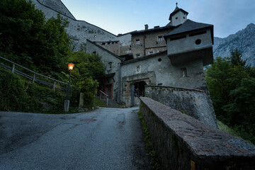 Wall Mural - Hohenwerfen castle and fortress surrounded by the Alpine mountains at dusk, Werfen, Salzburg, Austria