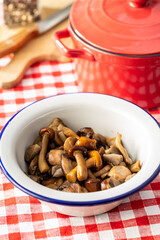 Poster - Sliced preserved mushrooms in bowl.