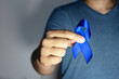 Blue november - man holding blue ribbon