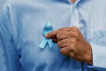 Blue November - Man Holding Blue Ribbon