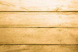 Fototapeta Desenie - Yellowed wooden plank floor with tree branches and stripes. Yellow background with wooden texture.