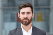 © Liubomir - freelancer man serious looking at camera, close-up portrait of a man in a business suit