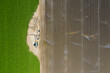 © Grindstone Media Grp - Aerial View Of Workers In A Field Harvesting Crops For Consumers