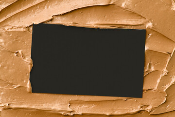 Wall Mural - Caramel frosting texture background with business card