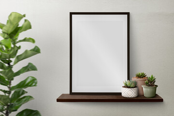 Dark modern picture frame on a shelf