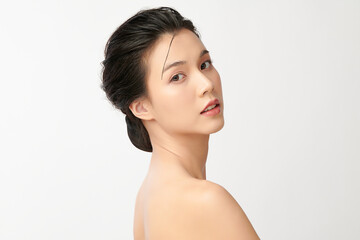 beautiful young asian woman with clean fresh skin on white background, face care, facial treatment, 