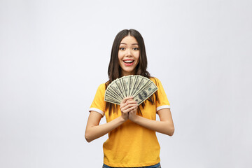 Wall Mural - Woman holding bank money note. Pretty young model showing cash. Closeup of gorgeous multi-ethnic Asian and Caucasian woman model isolated on white background.