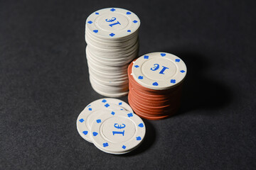 Poker chips on dark background