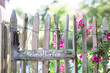 © Westend61 - Wooden sign and old key ring hanging on rustic fence