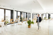 © Westend61 - Male business professional walking in office
