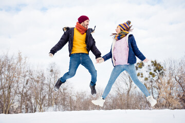 Sticker - Full length photo of crazy attractive girl handsome guy look each other hold hands have good mood in forest outdoors