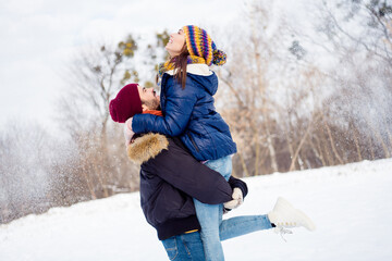 Poster - Profile photo of cheerful carefree persons man arms hold pretty lady have good mood free time in snowy forest outdoors