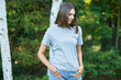 © Kalim - Young woman in gray shirt
