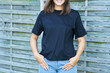 © Kalim - Young woman in black shirt