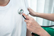 © Thitiphat - Doctor using a stethoscope checking patient about the problem of illness, sickness condition and recommend with examining treatment method