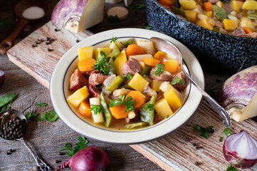 Wall Mural - Rustic stew with root vegetable and meat on a plate