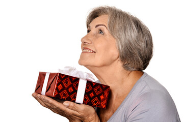 Canvas Print - Portrait of smiling senior woman posing with present