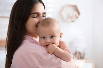 Wall Mural - Mother with her cute baby at home