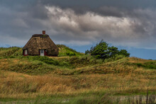 Traditional Fisherman's House With A Thatched Roof In The Nymindegab Dunes. South West Jutland, Denmark, Europe