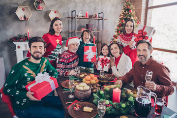 Canvas Print - Photo portrait full family in decorated apartment receiving festive gift boxes from santa claus sitting at table