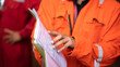 Action of a supervisor pointing on document paper for discussion during a safety audit and operation commisionning. Indsutrial worker people photo. Selective focus at the people hand.
