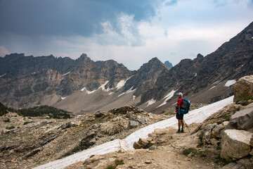 crossing paintbrush divide on the teton crest trail, grand teton national park, wyoming, usa
