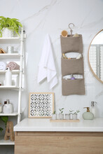 Knitted Organizer Hanging On Wall In Bathroom