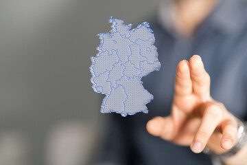 a virtual germany land map digital in hand 3d.