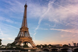 Fototapeta Boho - The Eiffel Tower at a beautiful sunset with blue sky and clouds.